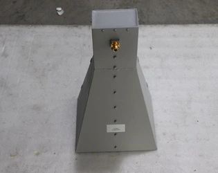 What is the structural design of a double-ridged horn antenna, and how do ridges enhance its broadband performance?